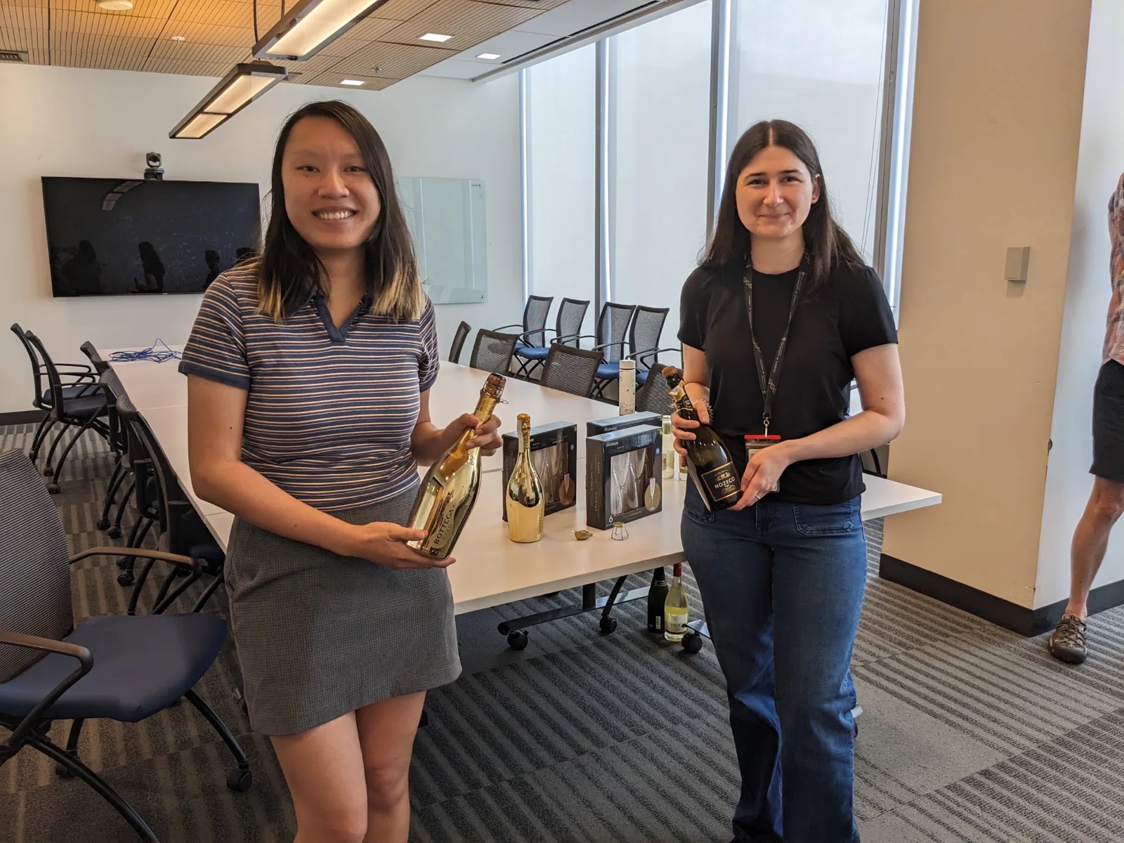 Nuo and Katherine opening the champagne